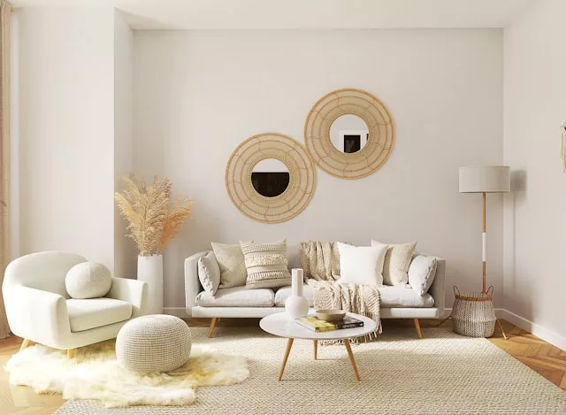 a white sofa set with a coffee table and home decors